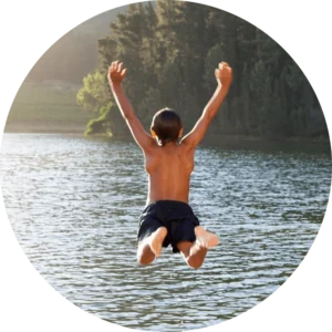 Child jumping into the water