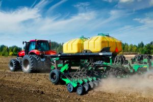 Modern, Red Tractor In The Spring Field Work
